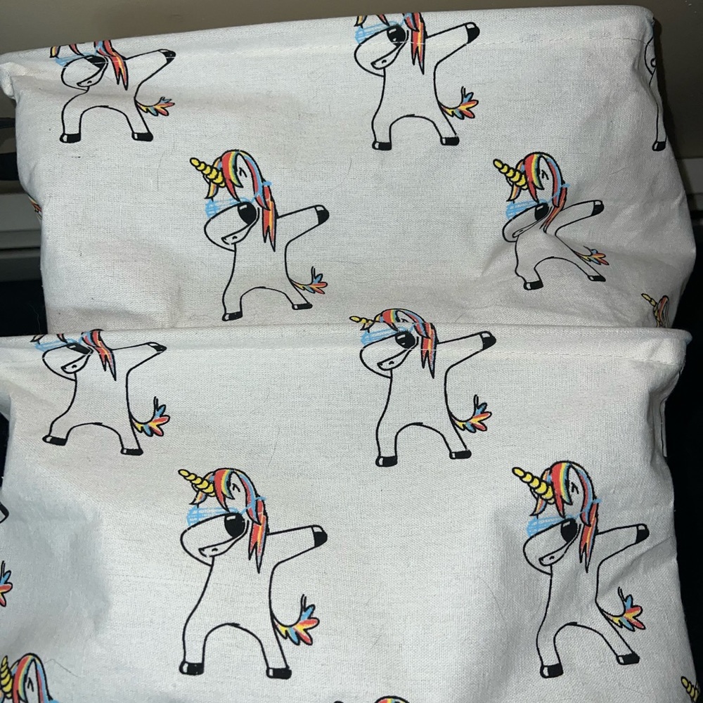 Unicorn Hamper and 2 cloth baskets.